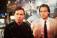 Image from: Real Men (1987)
