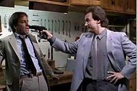 Image from: Real Men (1987)