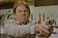 Image from: Real Men (1987)